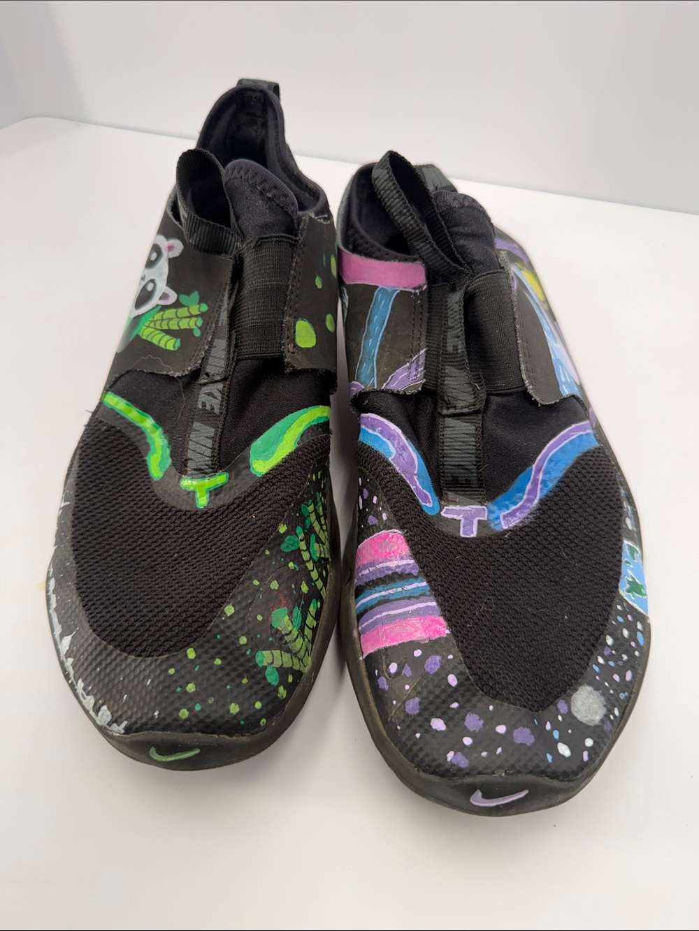 Nike Kids Slip-On Sneakers in Black with Neon Green & Purple Accents